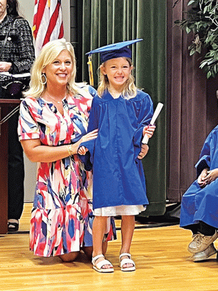Liliana Bollich receives her diploma from her teacher Aimie Fontenot during Highland Early Learning Center’s Pre-k graduation held Tuesday.