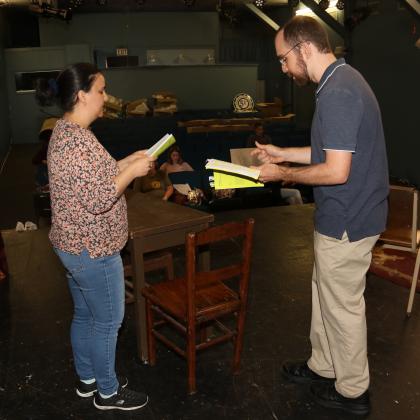 Kristi Burleigh, left, and Nathaniel Clark rehearse lines from “Aboveboard,” a play scheduled to be staged in June at the Eunice Players’ Theatre. The production is the first for the Eunice Players’ since the theater was shutdown by COVID-19. Photo by Harlan Kirgan)