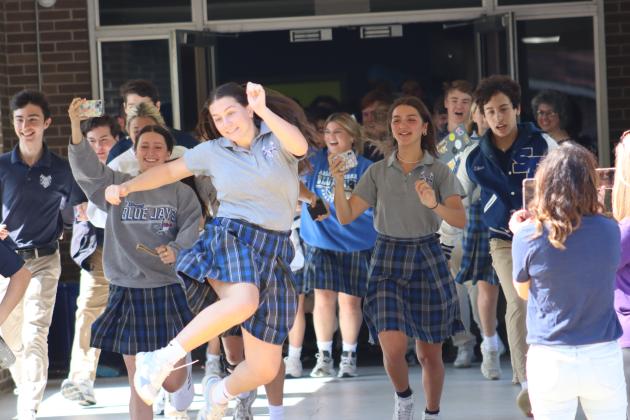 St. Edmund High seniors counted down the time on their last day of school. After counting down, the doors were opened and they ran out for the very last time. (Submitted photos)