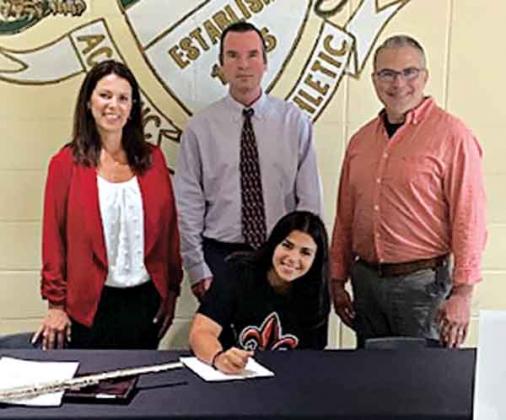 Eunice High School senior Kelly Sonnier accepted a full scholarship to the University of Louisiana Lafayette and to march with the Pride of Acadiana, the UL Marching Band.  Seated is Kelly Sonnier, and standing, from left, are Becky Sonnier, mother, Lamont Goodman EHS band director, and Mike Sonnier, father. (Submitted photo)
