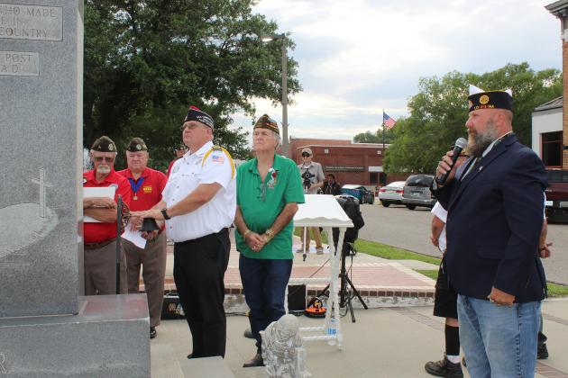 Donnie Fontenot, commander of the VFW Post 8971 rings the bell as each fallen hero’s name is called out by David Crader, commander of the American Legion Post 129. See more photos on page 2A.