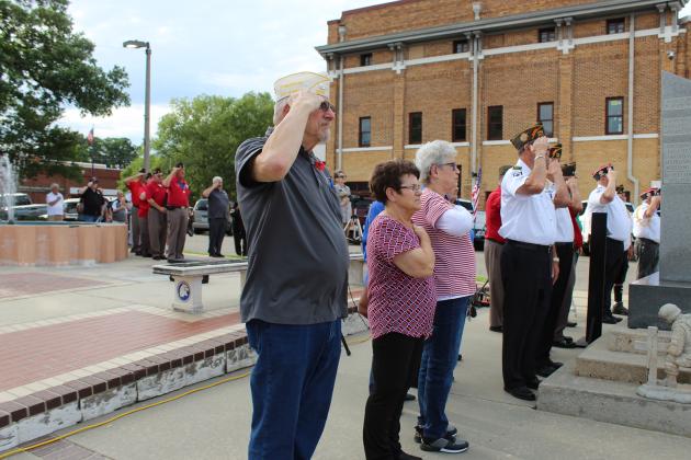 Reciting the Pledge of Allegiance during the Memorial Day ceremony.