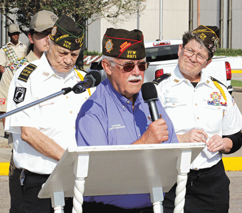VFW State Commander Don Reber, center, spoke about remembering those who died in service to the nation at the Eunice Memorial Day ceremony. VFW members show are Donald Estillete, left, and Christine Chataignier. (Photos by Harlan Kirgan)