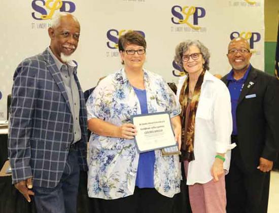 The St. Landry Parish School Board recognized retirees at its Thursday meeting. From left, are Albert Hayes Jr, Board presidnet; Brenda Ardoin, retired from Eunice High as a teacher with 34 years of service; Mary Ellen Donatto, Board member; and Patrick Jenkins, school superintendent. Eighteen retirees were recognized. (Photos by Harlan Kirgan)