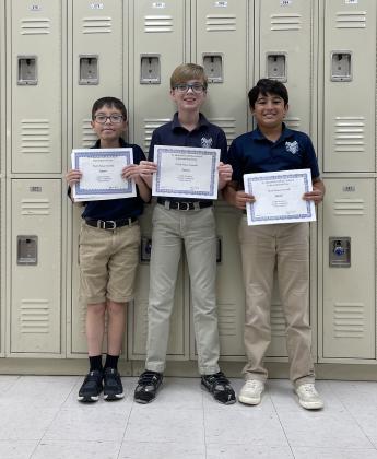 International Day third place overall winners were Joseph Borderline, left, Reese Manuel and Xander Langlinais.