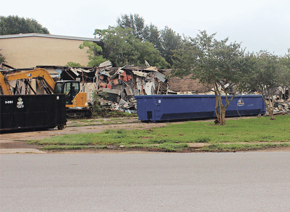 The demolition will cost about $30,000 according to St. Landry Parish President Jessie Bellard. Much of the work will be done by parish crews, he said. On Wednesday morning, a wall at the entrance to the hospital built in 1955 started coming down. (Photo by Myra Miller)