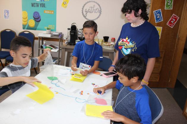 Children had the opportunity to create and design their own crafts during Vacation Bible School at First Baptist Church. Making a journal are Joseph Crawford, left, Maddix Matherne, McKinlee Duplichan and Xavier Smith.