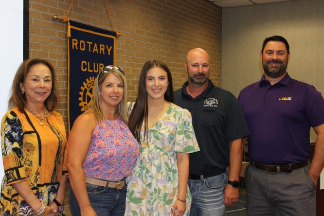 From left, are LSUE Chancellor Nancee Sorenson, Tiffany Pedigo, Olivia Pedigo, Casey Pedigo and Jacob Bergeron, Rotary president. (Photo by Myra Miller)