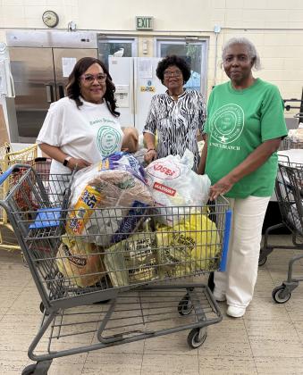 Members of the Eunice Branch National Association of University Women recently visited the Eunice Food Bank to bring a donation of canned goods, staples and delivery bags.