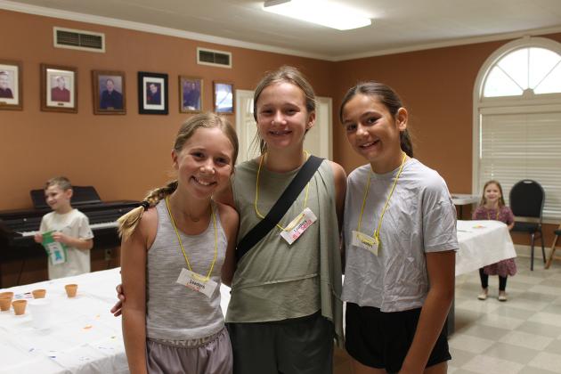 A group of volunteer counselors are seen at Happy Days camp. These girls help, direct and assist kids with different tasks. From left, are Emmy Garcille, Ella Mire and Isabella Huckaby.