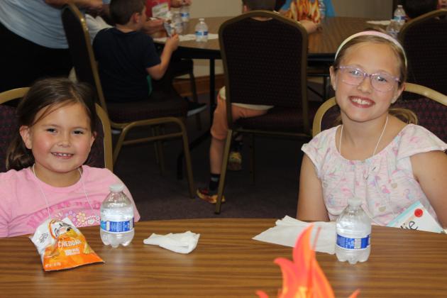 The theme of First Baptist Church in Eunice Vacation Bible School is “Breaker Rock Beach.” Children are learning and hearing Bible stories, scriptures, songs, and enjoying outdoor games and activities, arts and crafts and snacks. It’s snack time with Millie Berzas, 6, and Rhylie Dugas, 8.