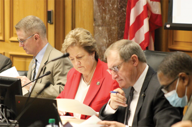 Louisiana legislators, Republican Sen. Sharon Hewitt (middle) and her GOP colleagues Sen. Barry Milligan (left) and Sen. Glen Womack, study new congressional district maps proposed at the Senate and Governmental Affairs Committee on Thursday, Feb. 3, 2022. (Wes Muller/Louisiana Illuminator)