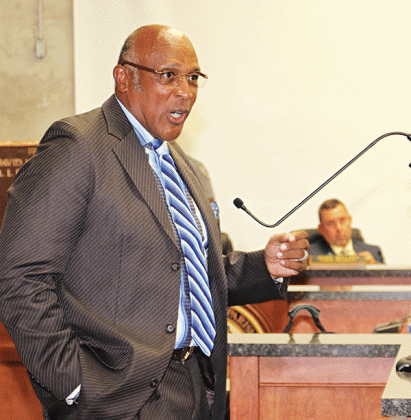 The Rev. Kerney Thomas speaks at Wednesday’s St. Landry Parish Council meeting. In the background is Parish President Jessie Bellard. (Photo by Harlan Kirgan)