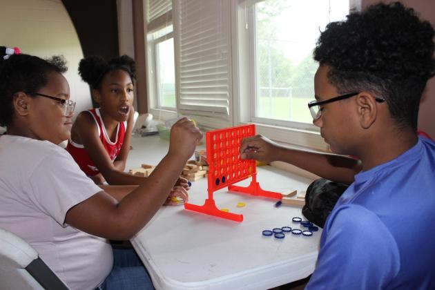 Playing a Connect 4 game are Mariah LeBlanc, left, Adalynn Thomas and Jeremiah LeBlanc.