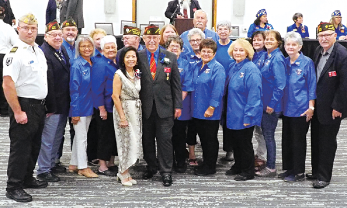 VFW members from Eunice gather around Don Reber and his wife, Thuy. (Submitted photo)