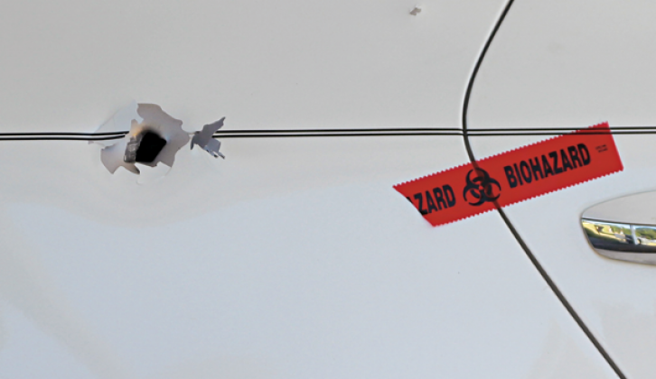 Bullet holes are visible in the car shot Thursday night.
