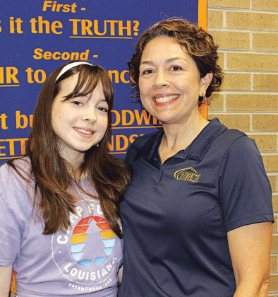 Magnet Academy of Cultural Arts student Liana Reed and her mother, Michelle, a teacher at MACA, at the Eunice Rotary Club meeting on Wednesday. (Photo by Myra Miller)