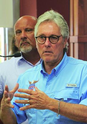 Sam Fulton, right, vice president of governmental affairs for Allegiance Health Management, and David ngram, CEO of Acadian Medical Center, attended a St. Landry Parish Council meeting on Wednesday. (Photo by Harlan Kirgan)