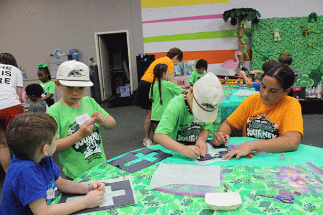 Crafting a cross at Summer Surge at New Hope Fellowship Tuesday morning were Jackson Guillory, left, Easton Turner, Connor Cormier and Jaycee Perry.