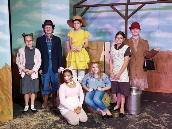 The Eunice Players’ Theatre will open with a summer play “Charlotte’s Web” beginning July 7. Seated, from left are Lillian Veillon as Wilbur, Scarlett Douget as Fairgoer. Standing, from left are Rebecca Fusilier as Fairgoer, Hewson Bourgeois as Mr. Zuckerman, Elle Soileau as Goose, Marley O’Brien as Mrs. Zuckerman, and Demi Vidrine as Fairgoer. (Submitted photo)