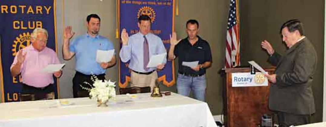 New Rotary Club officers take the oath of office led by former Judge Ellis Daigle, at right. From left, are Shirley Vige, treasurer; Jacob Bergeron, secretary; Dwight Jodon, vice president; and Coby Clavier, president. (Photos by Myra Miller)
