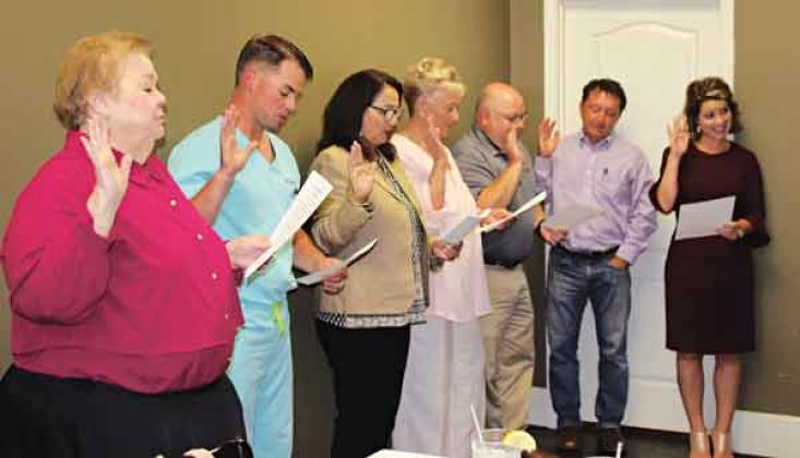 Swearing in of Rotary Club Board members was performed at an installation banquet Wednesday. Board members, from left, are Pat Dossman, Edward Turk, Michelle DeRouen, Lynn LeJeune, Van Reed, Donnie Richard and Kitty Jo Deshotel. Not pictured is Nickie Toups.