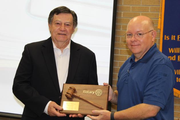 Van Reed, Rotary secretary, presented outgoing Rotary President Ellis Daigle with a plaque of recognition. The newly elected Rotary President is Erika Fontenot.