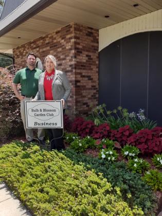 The Business Garden of the Month for July was preented to Bank Plus located at 151 South 4th, in Eunice. The bank features flowering beds of coleus, cannas, Lily of the Nile, calidius, jasmine ground cover, white abilia, Witch Hazel and crepe myrtles. From left, are Jacob Bergeron, bank president; and Yvette Delafose, senior bank teller. (Submitted photo)