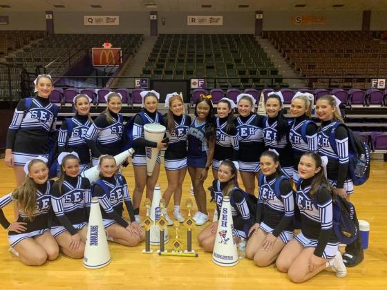 The St. Edmund High Varsity cheerleaders participated and captured several awards and titles at the UCA Cheer Camp held at Northwestern State University. Seated, in front, from left, are Eliana Manuel, Millie Miller, Clara Brown, Jillian DeVillier, Mary Helen Miller, and Laura Beth Zaunbrecher. In back, from left, are Madison Comeaux, Laura-Kate Miller, Helen Brown, Anna Fruge, Susannah Summerlin, UCA Cheer Camp Instructor; Kailey Miller, Greta Miller, Jeslyn Rider, Kate Fruge and Londyn Berzas.