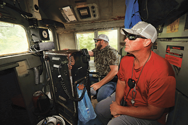 Inside the locomotive are, from left, Timothy Dickerson, engineer, and Tracy Brown, conductor.
