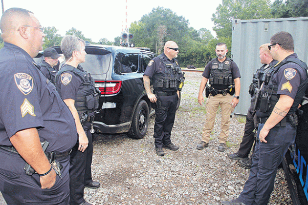Eunice Police officers and a Union Pacific Railroad police officer discuss a railroad crossing safety session on Tuesday morning at the railroad site off La. 13. From left, are Sgt. Sebastien Noel, Officer Chase Godeaux, Officer Corina Schexneider, Lt. Donnie Thibodeaux, Union Pacific Railroad senior special agent Joshua Guillory, Officer Bryan Wiles and Sgt. Trace Tilbury.