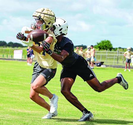 A Eunice High defender makes a move to defend a pass during Eunice High’s 7-on-7 scrimmage with Sacred Heart on Wednesday. The 7-on-7 format typically involves 20-minute games where teams only are allowed to pass but aren’t allowed to pass rush. It’s meant to give wide receivers, quarterbacks and defensive backs more extensive reps. (Photos by Dwight Jodon)