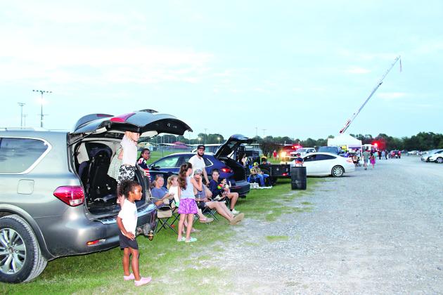 Many people arrived early for the 9 p.m. Fourth of July Fireworks Display Friday. Kenneth Peart, former mayor and pyrotechnist, has been putting on the fireworks display show for more than 40 years. Peart has many volunteer helpers, one in particular, Donnie Richard, a pyrotechnist also. Richard handles the shooting of the shells. Peart directs and produces the showing.