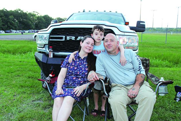 Summer, Kolton, and Bryan Hebert of Eunice  arrive early Friday evening to watch the fireworks display held at the Eunice Recreational Complex.