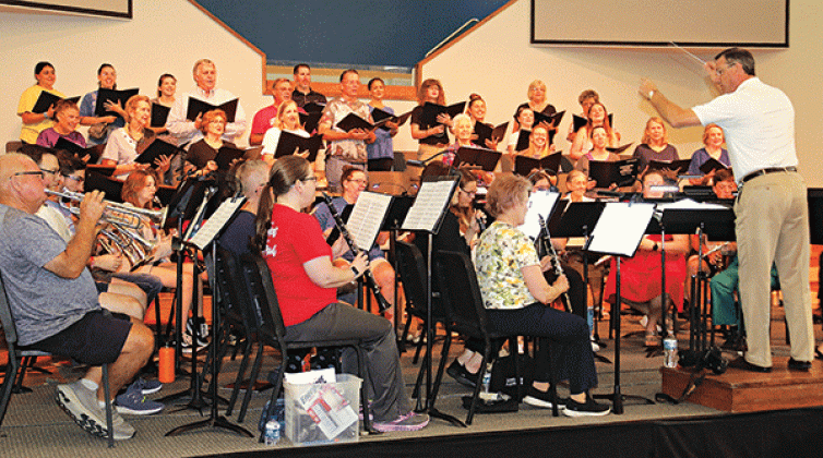 Director Dwight Jodon leads the Eunice Community Concert Band & Community Choir during practice Tuesday for the Summer Concert scheduled at 7 p.m. today and Friday at the First Baptist Church in Eunice. The program selections include, “Papa Loves Mambo” “When I’m Sixty-Four,” “The Prayer,” “We Don’t Talk About Bruno”, “Espana Cani,” “Nessun Dorma”, “Hey Baby,” “Tribute to Gershwin,” “Love Is an Open Door,” “We Will Remember,” “The Jungle Book,” “Hernando’s Hideaway,” and “Sheherazade.” Tickets are  $5 for a