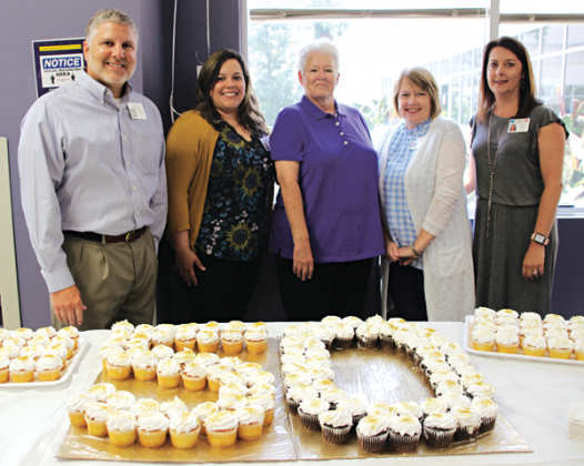 Marcella Prejean was surprised with a celebration event honoring her working at the hospital for 50 years. From left, are CEO of Acadian Medical Center Kevin Frank, Natalie Lemelle, associate chief financial officer; Prejean; Janice Jones, chief financial officer; and Julie Paul, chief nursing officer. (Photo by Myra Miller)