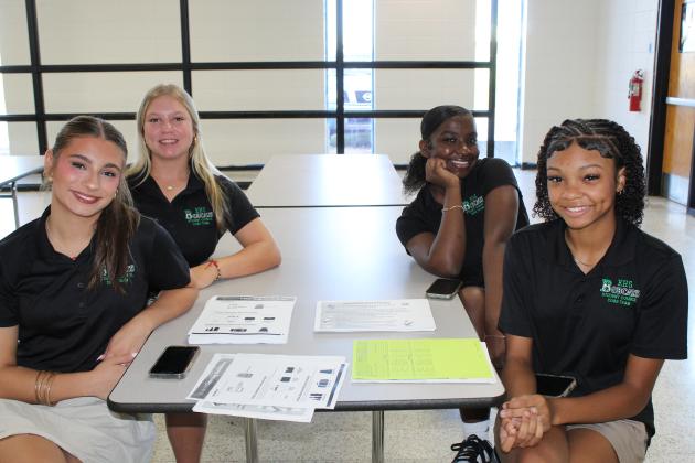 Eunice High students follow student back pack guide lines as well as water bottle guide lines during the school term. Assisting students with this task at registration are from left Ava Elfert, a junior; Eva Sattler, a sophomore; Cayli Lemelle, a junior; and De’Miyah Reed, a senior.