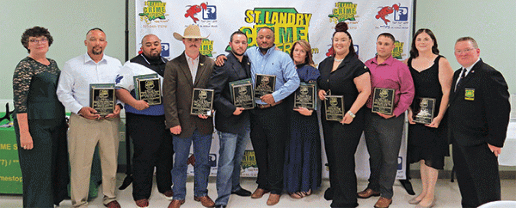 From left, are: Sgt. Elizabeth Bernard, with Crime Stoppers; Deputy Chief Jeremy Ivory,  Supervisor of the Year, Eunice Police Department; Deputy Timothy Lazare, Correctional Officer of the Year, St. Landry Sheriff’s Office; Capt. Cody Richard-Officer of the Year, St. Landry Sheriff’s Office; Lt. Drake Pousson, Judge Robert Brinkman Superior Officer of the Year, St. Landry Sheriff’s Office; Lt. Julian Tibbs, Judge Robert Brinkman Superior Officer of the Year,  St. Landry Sheriff’s Office; Lt. Regina Rinaldi