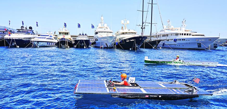 A solar-powered boat designed and built by a team of UL Lafayette mechanical engineering students recently became the first from the U.S. to compete in the Monaco Energy Boat Challenge. The five-member Southern Solar team’s innovative vessel (foreground) was showcased during races, demonstrations and a presentation at the event in Monaco, on the coast of the Mediterranean Sea. (Submitted photo)