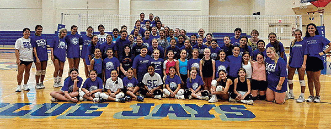 St Edmund’s volleyball team held a camp Monday through Wednesday for fifth- to eighth-grade students. Campers were taught different skills like digging, attacking, blocking and how to serve. They also were able to scrimmage at the end of the day. Pictured here are senior Lauren Bearb bumping with sixth-grader Molly Miller. Ellie Reed is observing. Campers are shown in a group photo, above. (Photo by Amy Myers)