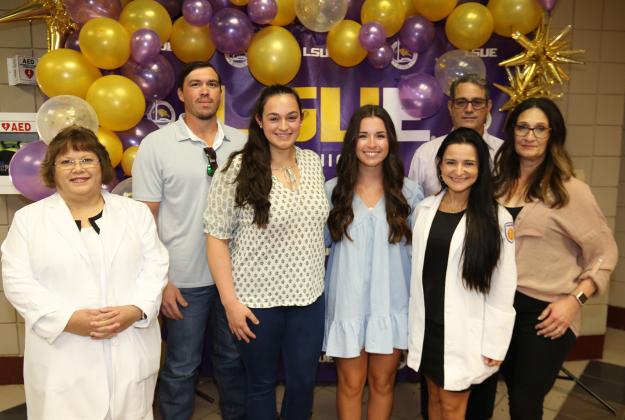 The first Amy Olivia Guidry Memorial Scholarship was awarded during the White Coat Ceremony at LSUE on Thursday. Guidry was a LSUE nursing graduate and nurse at the Lafayette General Hospital emergency room who died in July 2021. From left, are Mae Simoneaux, LSUE program director; Skee and Brittany Smith; scholarship recipient, Taylor Doughty; Chelsie Blanchard, of Ochsner Hospital Lafayette; and Wendel and Vanda Guidry, of Church Point. Brittany Smith is Guidry’s sister and the Guidrys are her parents.