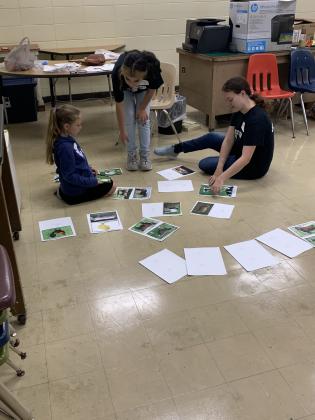 From left, Mary Fontenot listens to instructions from Jasmine Vargas, FFA member, and Aeryn Doucet, FFA member, in the livestock mammal identification session during EHS FFA’s Ag Camp held recently.