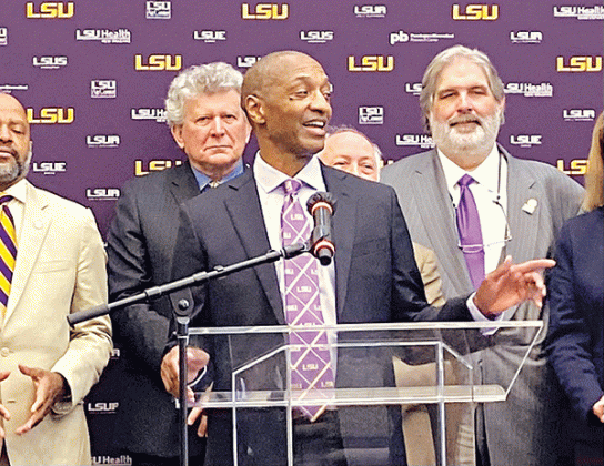 In this file photo from May 2021, William Tate gives his first press conference as LSU president-elect with members of the LSU Board of Supervisors behind him. (JC Canicosa/Louisiana Illuminator)