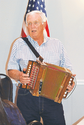 Ken Lyon presented an interesting history of the accordion to the Crowley Lions Club, telling members that the symbol of Cajun French music actually comes from Germany. (Photos by Steve Bandy/Crowley Post-Signal)