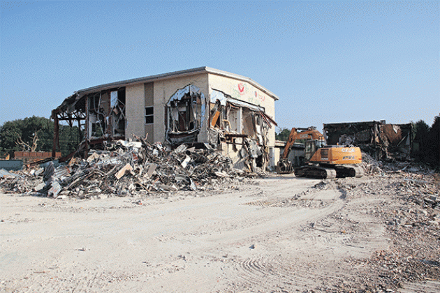 The old Moosa Memorial Hospital continues to disappear as demolition work progresses. St. Landry Parish President Jessie Bellard explained at a Parish Council meeting Wednesday the next big piece of the building to be razed is the two-story section. A building with about 13,000 square feet is to be retained and refurbished for office space, he said. Metal extracted from the building is being sold to recyclers and other material is being  used on parish roads, Bellard said. The cleared property will be aucti