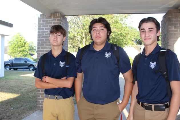 Wiley Middlebrooks, Benji Guillory and Payton Credeur, all sophomores, arrived on the high school campus early Wednesday for their first day of classes. Mitchell Fontenot is the principal at St. Edmund Catholic School.
