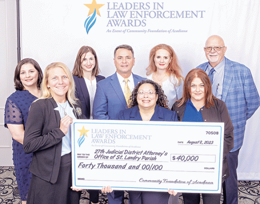 The St. Landry Parish District Attorney’s Office was awarded the statewide “Leaders in Law Enforcement Award” given by the Community Foundation of Acadiana in Lafayette on Tuesday. The District Attorney’s staff includes, back row, from left, are Nancy Soileau, Katie Ryan, Chad Pitre, Alisa Gothreaux and Ricky Leger. Front, from left, are Heather Meyers, Donna Slate and Vickie Lanclos. (Submitted photo)