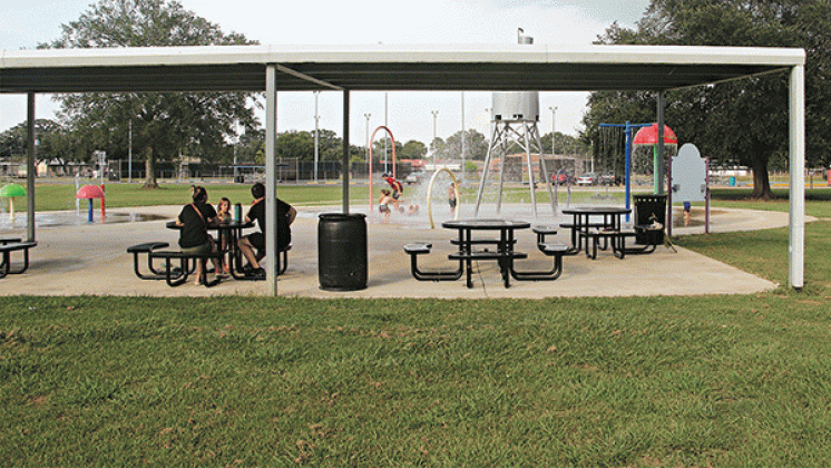 The addition of tables at the splash pad at Fairground Park in Eunice has made enjoying the outdoors easier this year. The area is covered allowing the adults shade and a seating area while the children play in the water. There is another splash pad behind Central Middle School. (Photo by Harlan Kirgan)