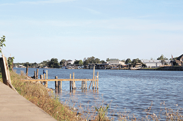 Bayou Barataria flows alongside the town of Jean Lafitte, where rebuilding continues nearly three years after Hurricane Katrina. (Aidan McCahill for Louisiana Illuminator)