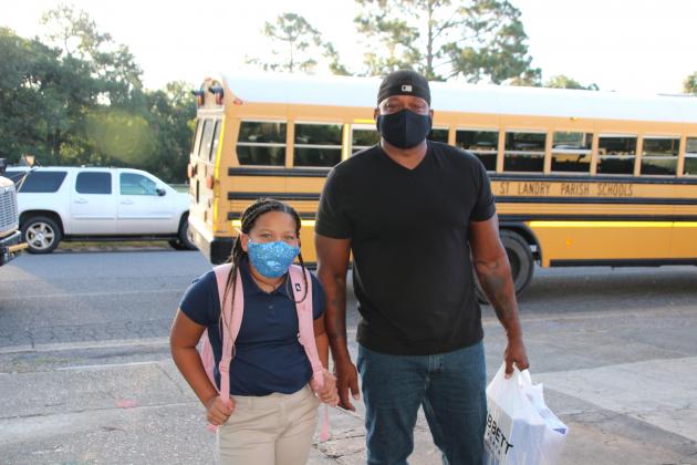 Nadia Guillory, a fourth grader at Eunice Elementary, arrived with her father O.J. Guillory early Wednesday morning for her first day of school.